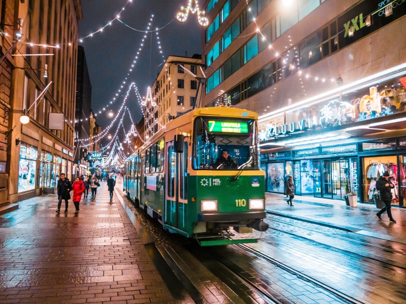 finland, christmas light, city street, city, track, tramcar, mode of transportation, built structure, tram, cable car, group of people, illuminated, helsinki