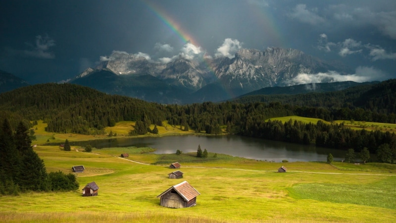 clouds, green, leisure activity, mountain range, hills, nature, non-urban scene, tree, mountain peak, lake, plant, grass, cloud - sky, cottage, beauty in nature