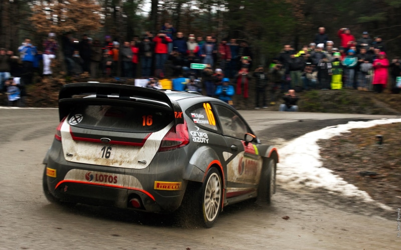 street, outdoors, rally cars, wrc, text, Robert Kubica, car, city, land vehicle, architecture, Rallye, focus on foreground, road, motion, race cars, toy car
