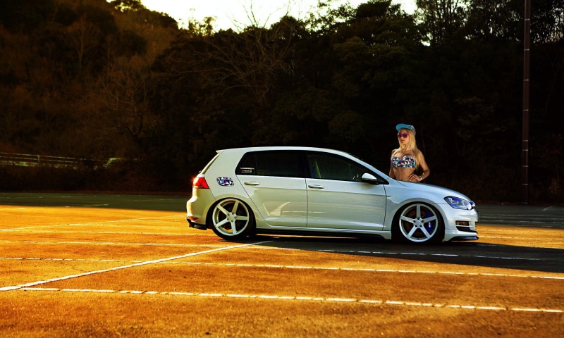 Volkswagen, women, sitting, full length, sunlight, day, land vehicle, mode of transportation, car, hatchback, transportation, silver, golf, standing, real people