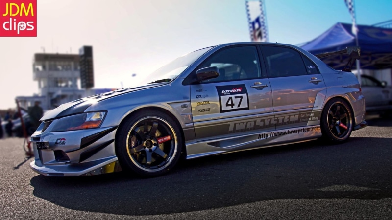 Mitsubishi Lancer, transportation, outdoors, nature, mode of transportation, city, day, motor vehicle, no people, police car, focus on foreground, land vehicle