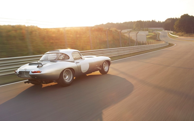 speed, road, nature, sunlight, sky, sports race, clear sky, Jaguar, no people, transportation, land vehicle, plant, day, motion, road trip, car, tree, city
