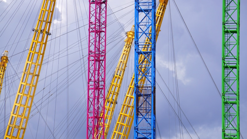 low angle view, paint, docklands, no people, millenium, assorted, outdoors, 02, science and technology, cable, metal, mode of transportation, tall - high