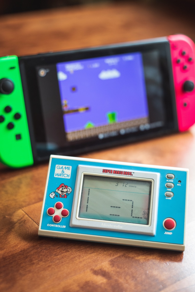 cell phone, screen, mario, equipment, digital display, switch, mobile phone, super mario, man made, control, electrical device, electronics, close-up, table