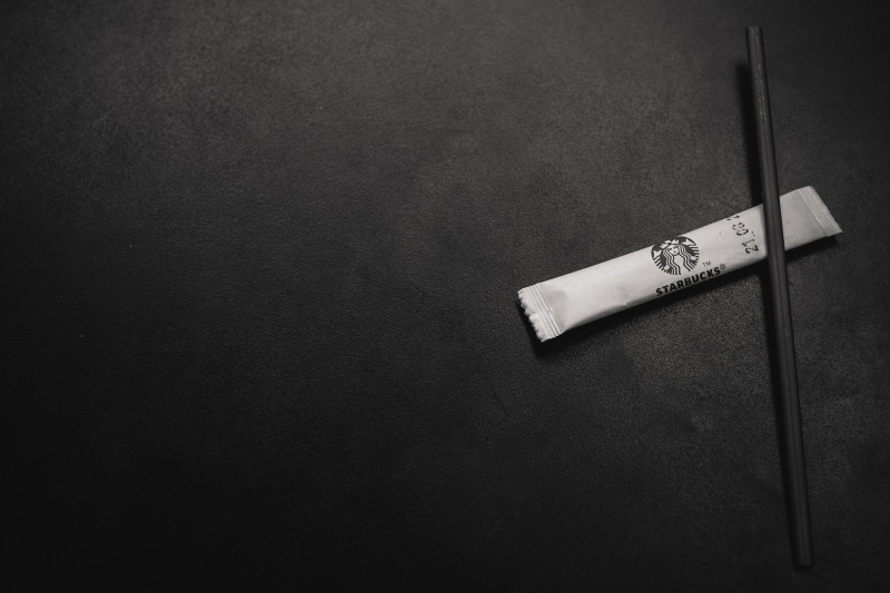 packet, straw, black color, sachet, single object, grayscale, table, writing instrument, metal, white, pack, close-up, photography, wall - building feature
