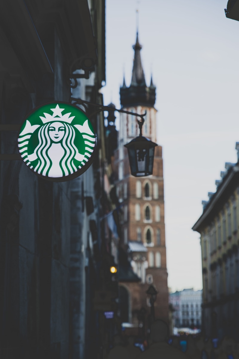 sky, no people, low angle view, brand, cool place, built structure, starbucks, best place, focus on foreground, neon, day, shop front, clock, facade, architecture