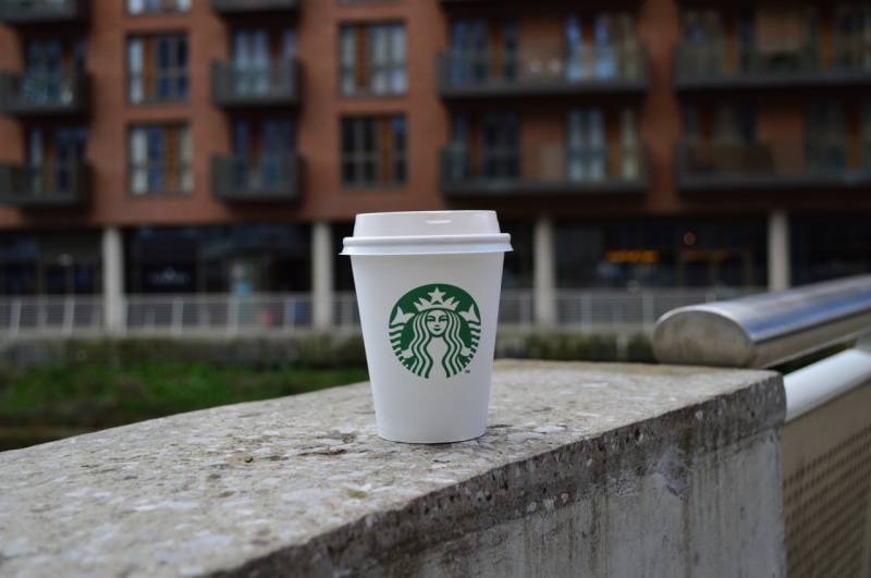 building, text, Leeds, city, communication, bridge, railing, day, starbucks, no people, food, table, architecture, close-up, built structure, selective focus