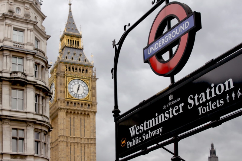built structure, clock tower, architecture, sign, low angle view, cloud - sky, travel, famous Place, london - England, guidance, building exterior, urban Scene