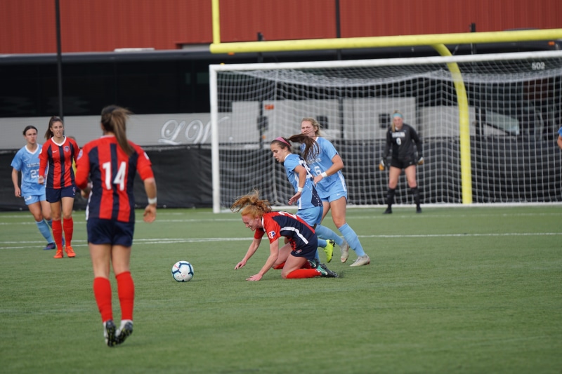 building, group of people, team, teamwork, team sport, sports uniform, playing, person, effort, stadium, sphere, human, 5K, competition, soccer ball, grass