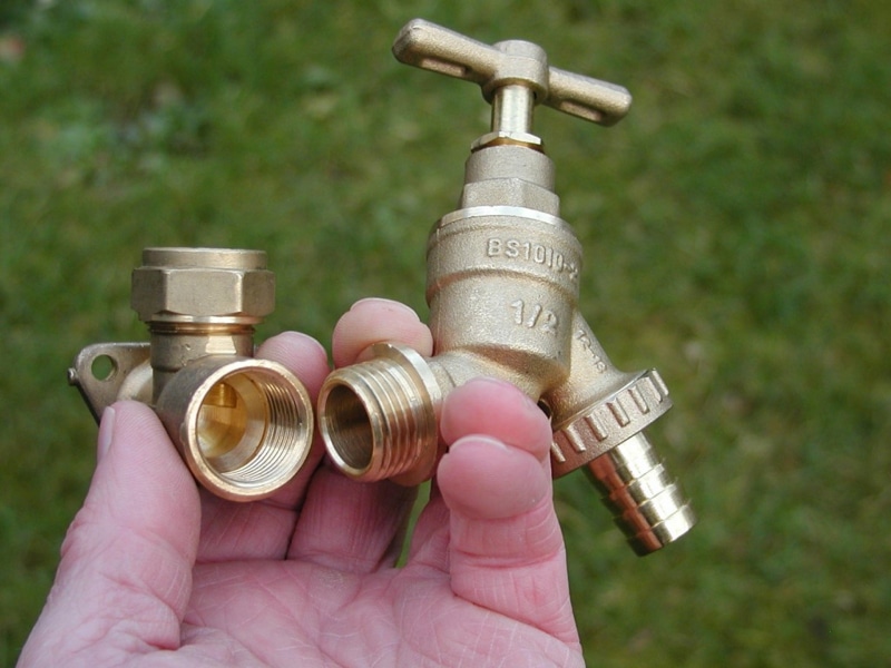 pipe, bib, spigot, gold, pink color, human body part, construction, bib cock, high angle view, outdoors, 1080P, copper, body part, one person, finger