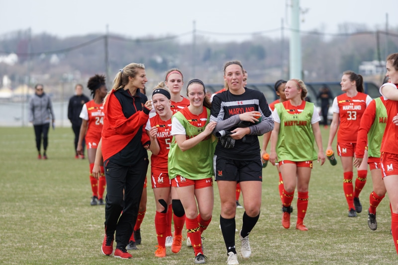 females, focus on foreground, teenager, 5K, football, real people, group of people, day, sport, person, field, cooperation, team sport, american football