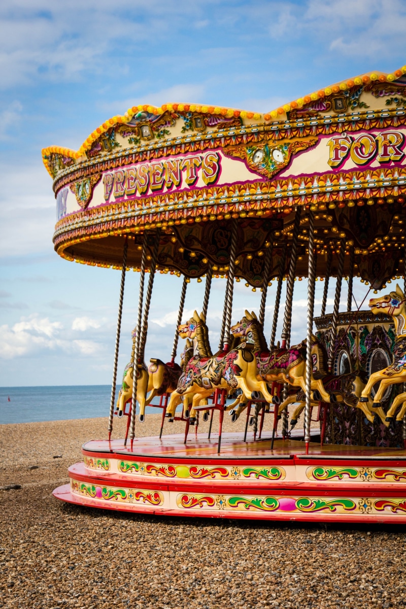 brighton, horse, fun, merry-go-round, arts culture and entertainment, decoration, sky, building exterior, water, empty, multi colored, ride, amusement