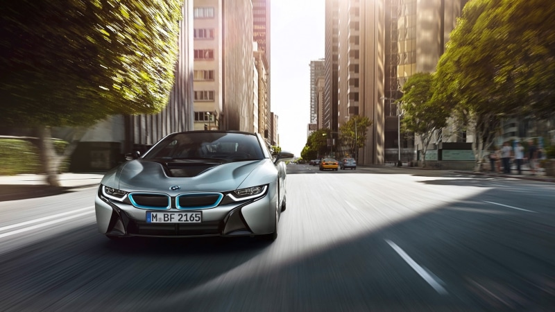 speed, on the move, city, architecture, office building exterior, mode of transportation, tree, road, BMW, built structure, street, building, nature, motion