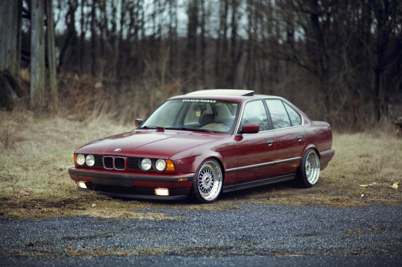 mode of transportation, modern, reflection, chrome, stance, outdoors, grille, E34, headlight, elegance, saloon, tree, plant, road, old, nature, engine