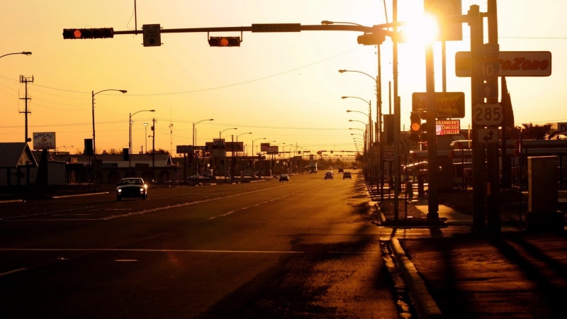 no people, silhouette, built structure, road, building exterior, land vehicle, mode of transportation, city, sign, photography, street light, car, city street