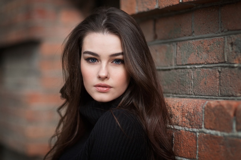 brick, brunette, 1080P, teenager, pale, bricks, portrait, fashion, depression - sadness, beautiful woman, emotion, headshot, young adult, model, black sweater