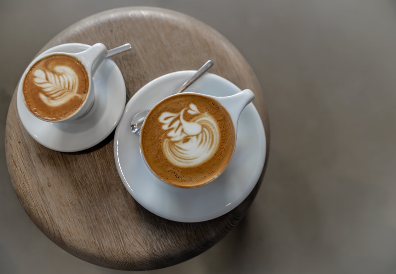 indoors, mug, wooden, refreshment, food and drink, table, spoon, caffeine, drink, cappuccino, coffee, close-up, art, crockery, wood, heat - Temperature