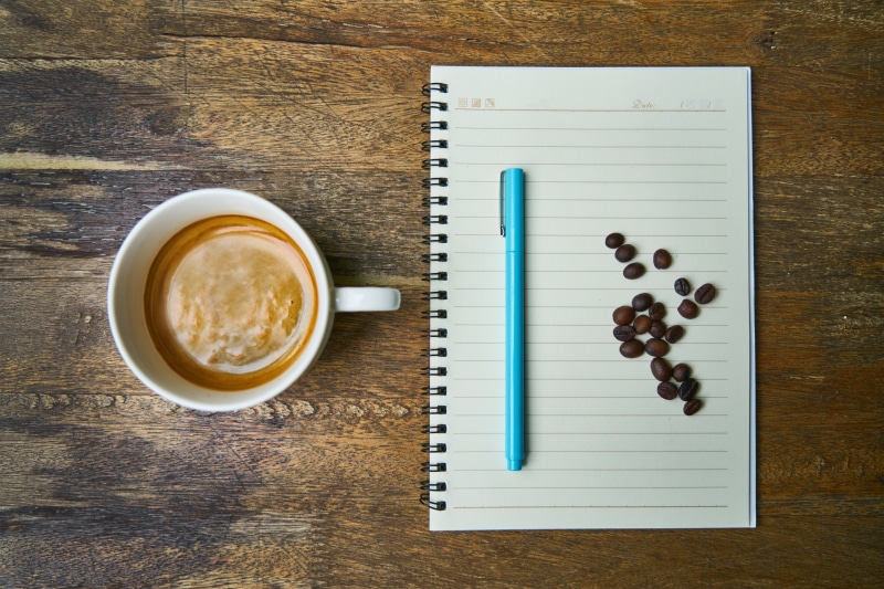 non-alcoholic beverage, no people, notebook, drink, directly above, latte, book, flat, freshness, close-up, coffee, desk, coffee drink, food and drink