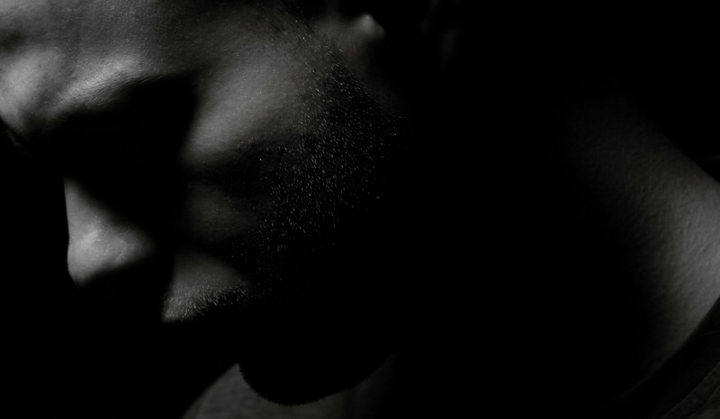 loneliness, young model, real people, body part, adult, male, male person, serious, young, male model, overview, sadness, black and white, human lips, human body part