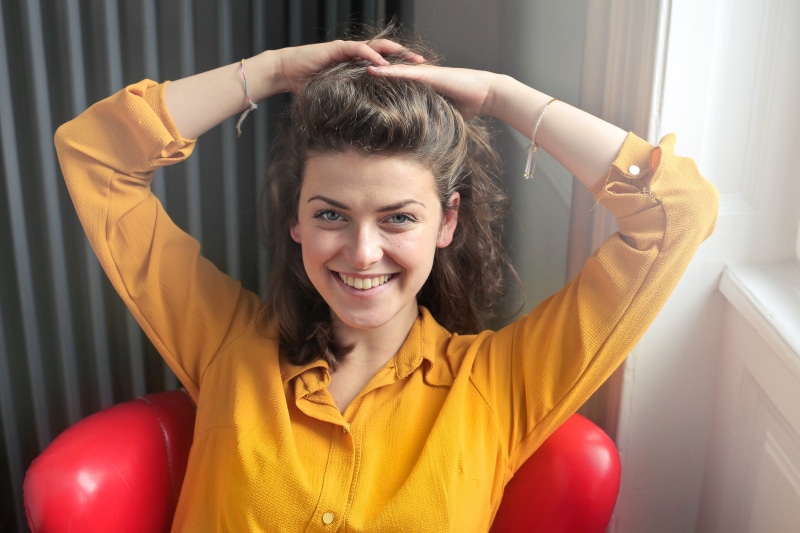 collared shirt, hands on hair, one person, emotion, One Woman Only, Home, young, happiness, red, cheerful, woman, beautiful woman, wearing, hands in hair