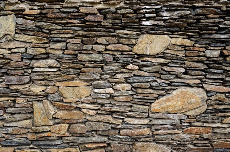 backdrop, roof tile, pattern, abstract, outdoors, stone material, textured, wall - building feature, built structure, abundance, no people, stonewall, block