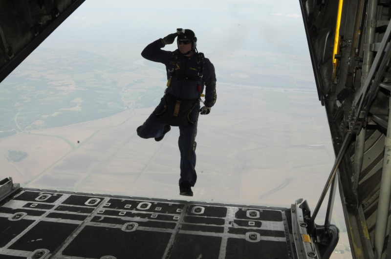 airplane, full length, built structure, mid-air, men, day, mode of transportation, fall, high, extreme sports, lifestyles, jumping, man, text, stunts, parachute