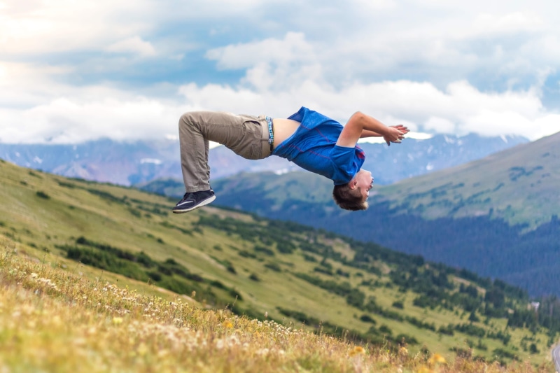 grass, day, tumbling, person, leisure, sky, jumping, adult, casual clothing, beauty in nature, plant, 4K, land, nature, recreation, one man only, mountain