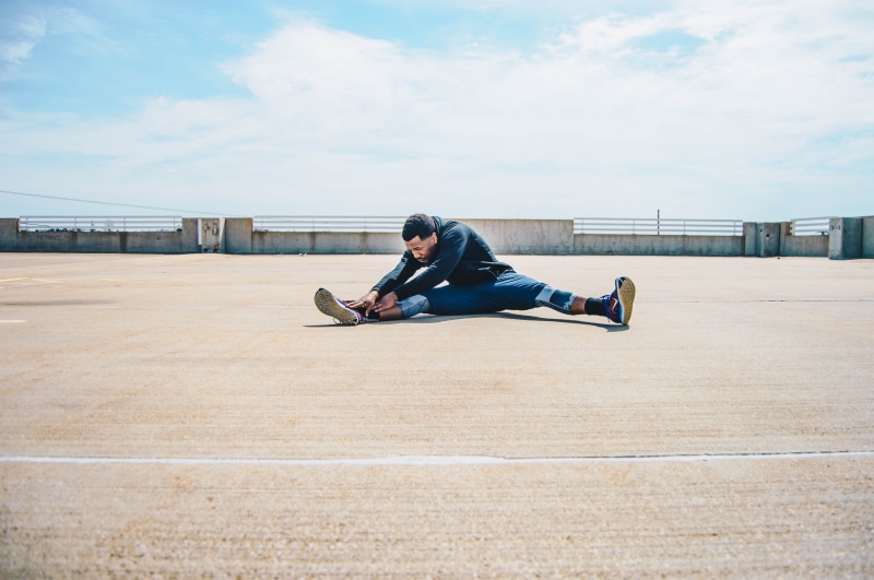 lifestyles, warm, nature, guy, men, relaxation, stretch, side view, people, connection, gray, male, stretching, day, wearing, black, cloud - sky, one Person