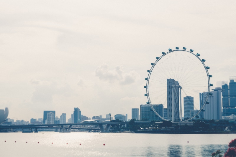 built structure, outdoors, architecture, amusement park, skyscraper, ferris wheel, singapore flyer, building, no people, nature, cloud - sky, financial district