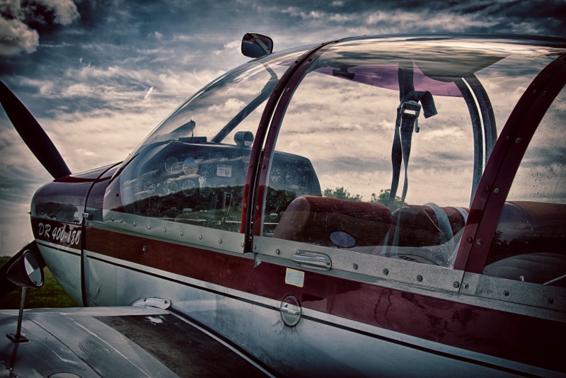 glass - material, motor vehicle, monoplane, sky, land vehicle, low-wing monoplane, instruments, gray, car, transportation, outdoors, mode of transportation