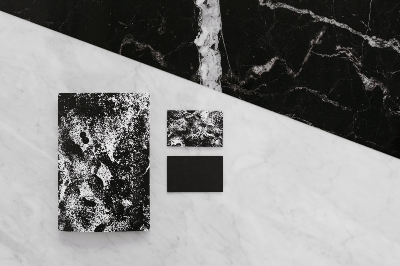 day, high angle view, flooring, architecture, tile, marble, business, corporate, table, water, wall - building feature, black, brand, tiled floor, white color