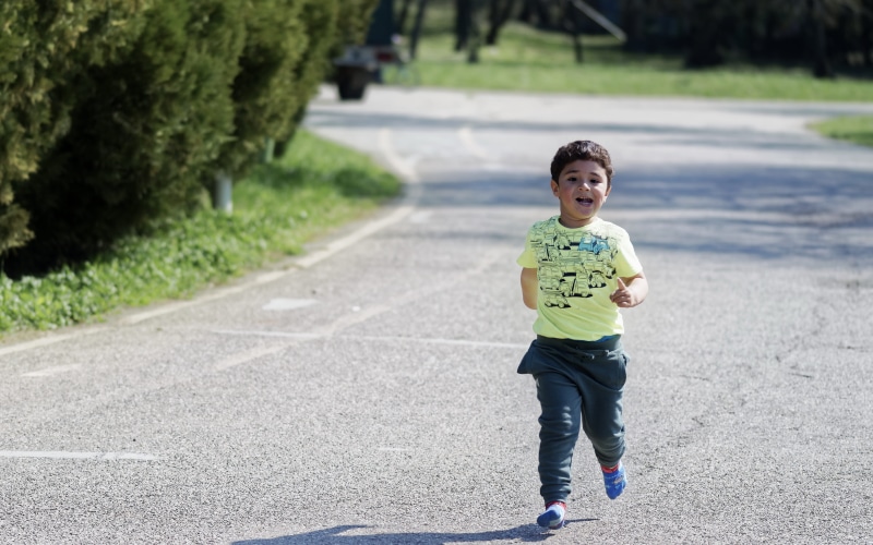 spring, males, treadmill, child, t-shirt, nature, innocence, trees, asphalt, plants, sports, men, stockings, smiling, running, real people, front view