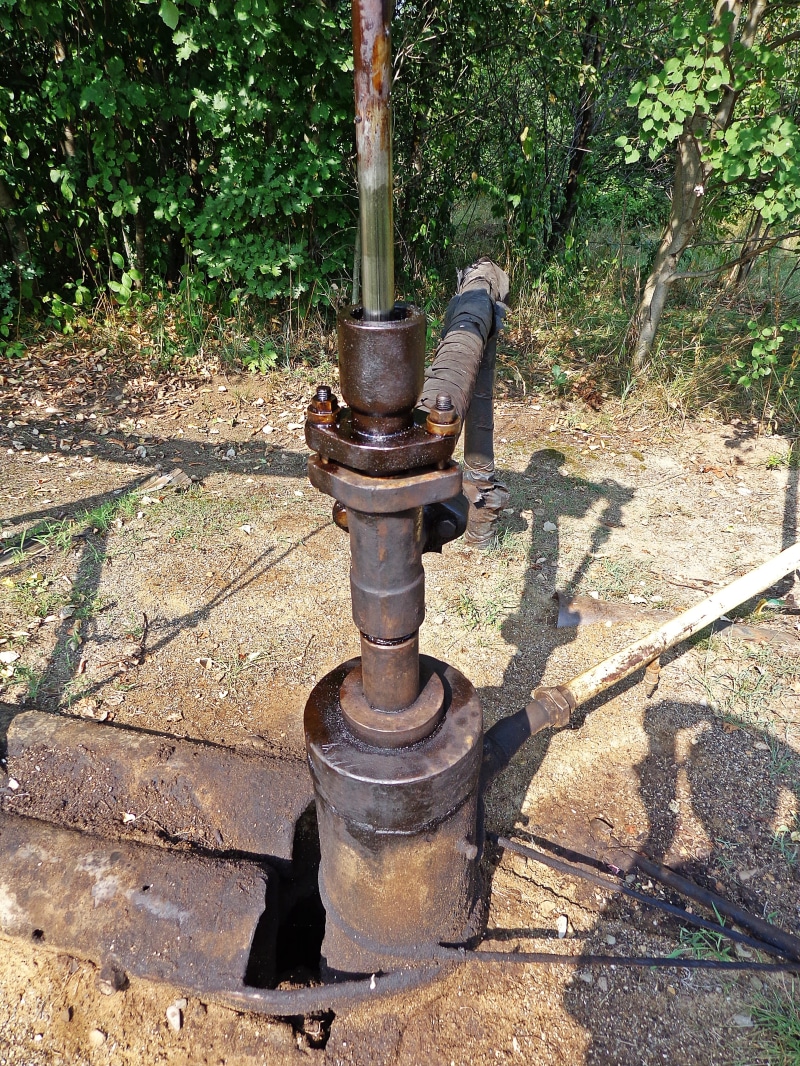 treadmill, high angle view, old, park - man made space, the pump, the pipeline, architectural column, sunlight, search, glazing oil, built structure, gas
