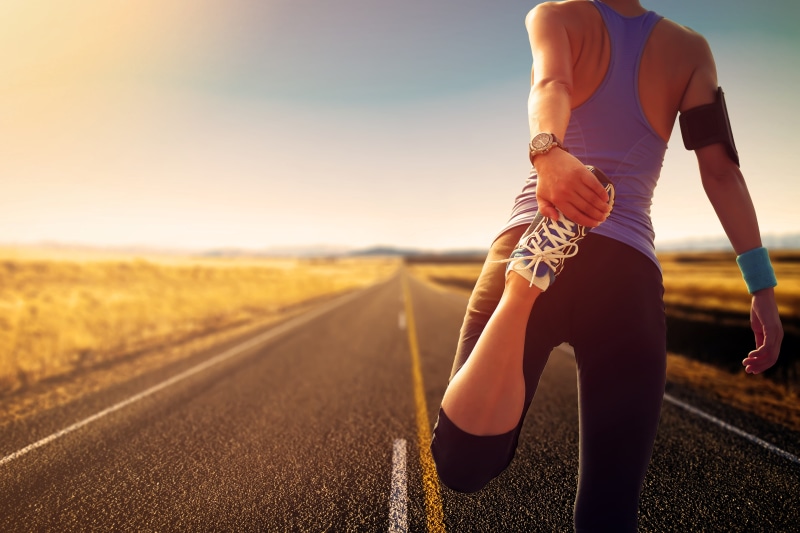 one person, sports, lifestyles, adult, running, women, young adult, horizon, sunlight, athlete, outdoors, sport, woman, 5K, road, walk, stretching, exercising