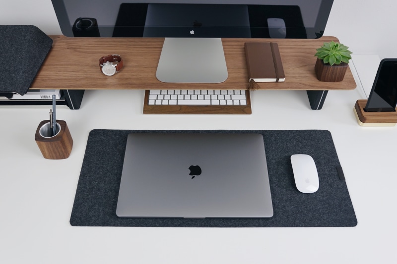 note pad, grovemade, laptop, indoors, computer, macbook, table, high angle view, mat, food and drink, desk, keyboard, technology, wireless technology, black