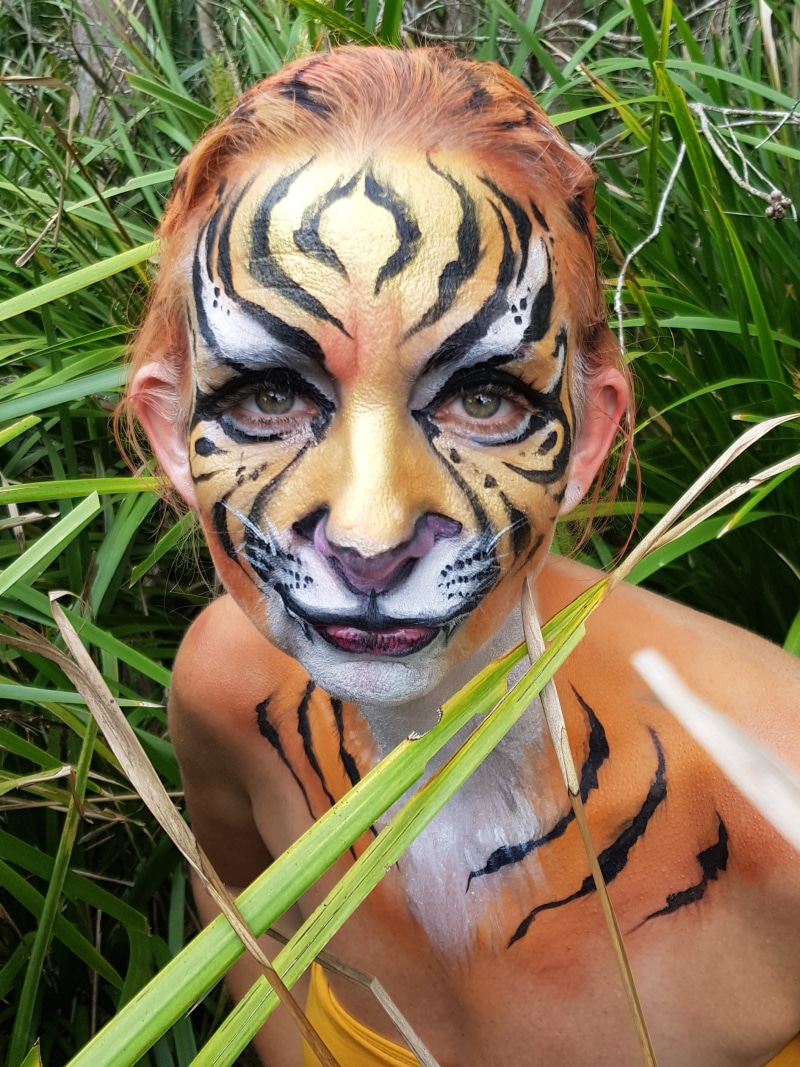 one person, headshot, tiger, young adult, close-up, 2K, young women, plant, looking at camera, nature, women, bodypaint, grass, front view, facepaint