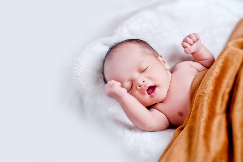vulnerability, sleeping, real people, young, adorable, indoors, cute, child, new life, childhood, eyes closed, little, innocence, lying down, infancy, one person