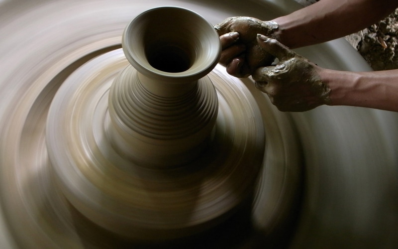 molding a shape, human body part, hand, skill, pitcher - jug, spinning, working, making, Clay, dirt, preparation, human hand, indoors, mud, hands, creativity