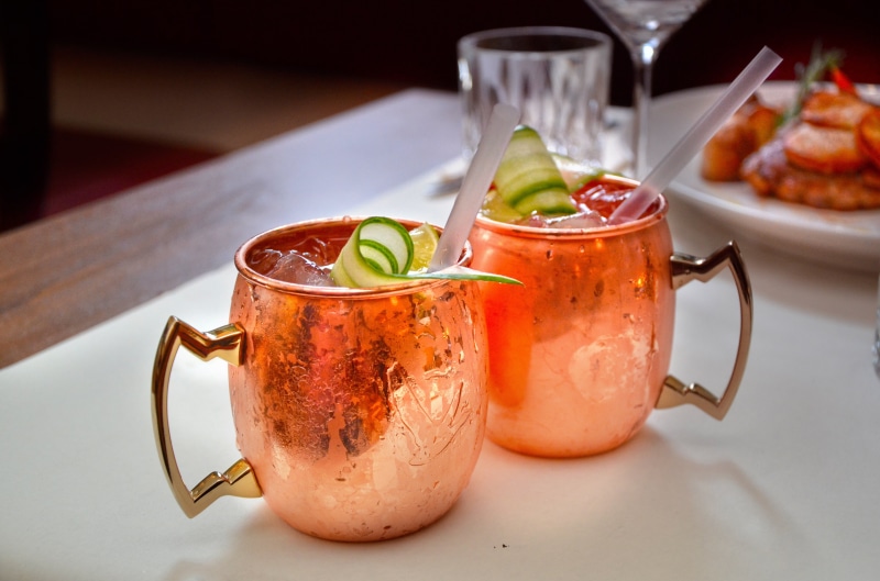 brass, tomato, delicacy, spirit, pub, taste, bar, tea - Hot Drink, cold temperature, bottles, alcoholic beverage, mix, service, two, tavern, herb, vegetable
