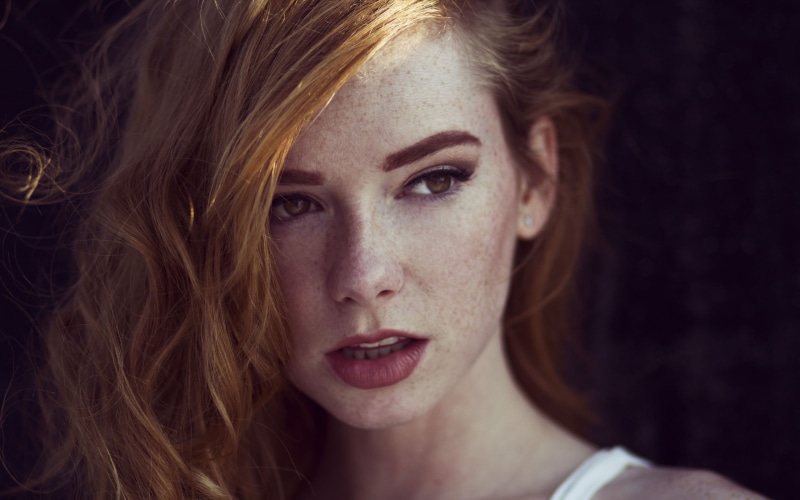 readhead, emotion, black background, solo, women, one person, adult, close-up, 2K, redhead, sadness, open mouth, young women, red lipstick, portrait, hazel eyes