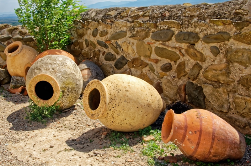 large group of objects, 8K, no people, storage, jugs, day, metal, explosive, deterioration, amphora, rusty, tire, outdoors, field, decline, historically