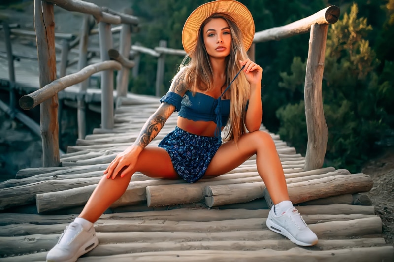 bokeh, hairstyle, portrait, sitting, pose, sneakers, topic, 1080P, model, Rus, bridge, tattoo, beautiful, trees, hat, figure, look, sexy, makeup, legs