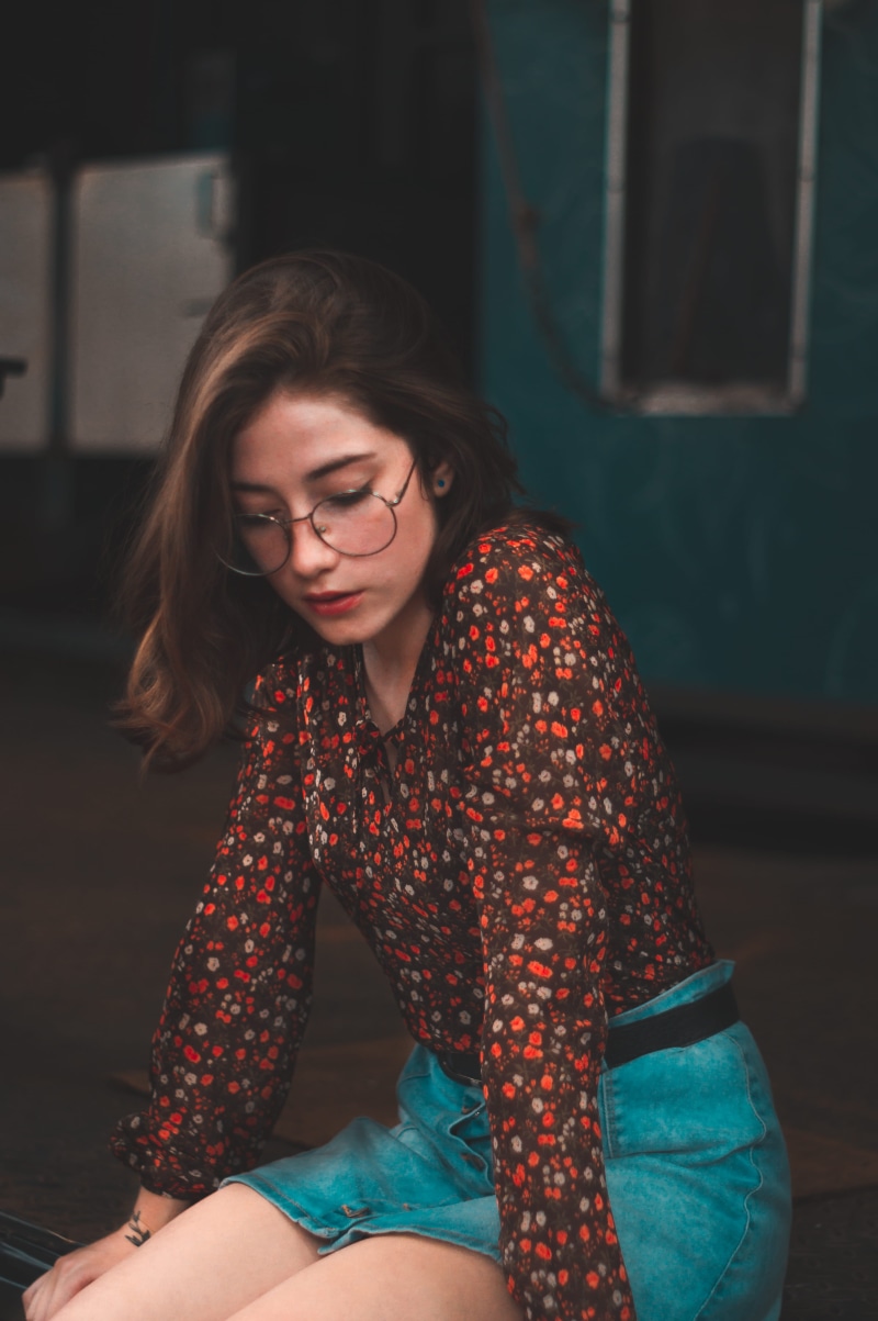 facial expression, fashion, dark, three quarter length, lifestyles, woman, skin, young adult, hairstyle, skirt, hair, front view, adult, wear, young, leisure activity