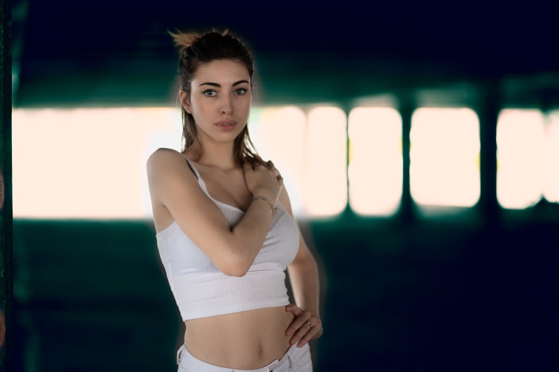 white tops, waist up, front view, one person, looking at camera, brunette, portrait, adult, focus on foreground, belly, beauty, model, 2K, Luigi Malanetto