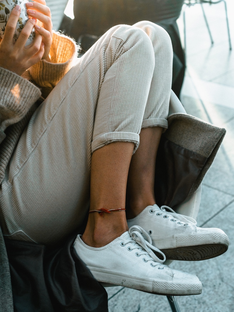 adult, real people, casual, leisure activity, pants, sneakers, shoelace, high angle view, body part, legs, leisure, human body part, low section, midsection