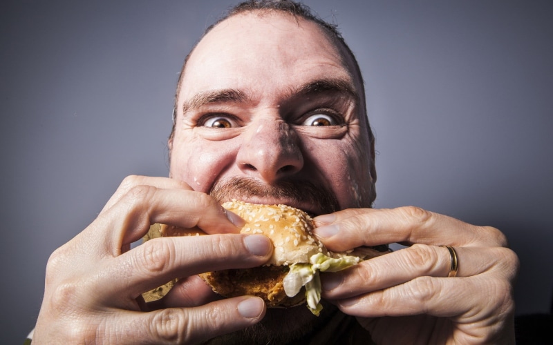 body part, gold, necklace, fast food, human face, mature men, front view, looking at camera, colored, portrait, food and drink, eating, gray background