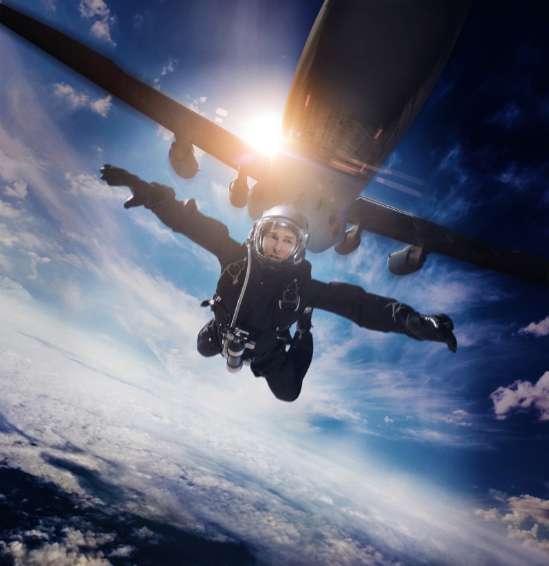 low angle view, one person, outdoors, human arm, limb, lens flare, mid-air, sport, human limb, skydiving, leisure activity, sky, full length, cloud - sky