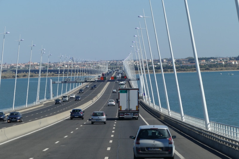 car, city, vasco da gama, outdoors, day, architecture, transportation, street, clear sky, sky, bridge - man made structure, no people, object, traffic