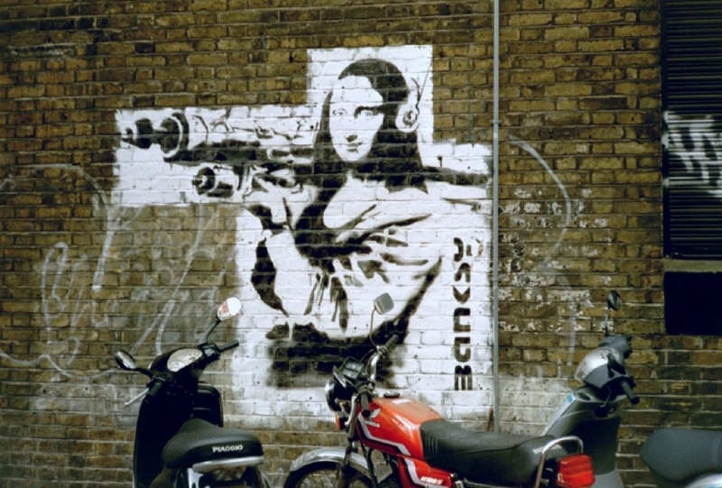 brick wall, human body part, human representation, representation, mural, wall - building feature, poster, wall, day, Banksy, text, people, brick, urban
