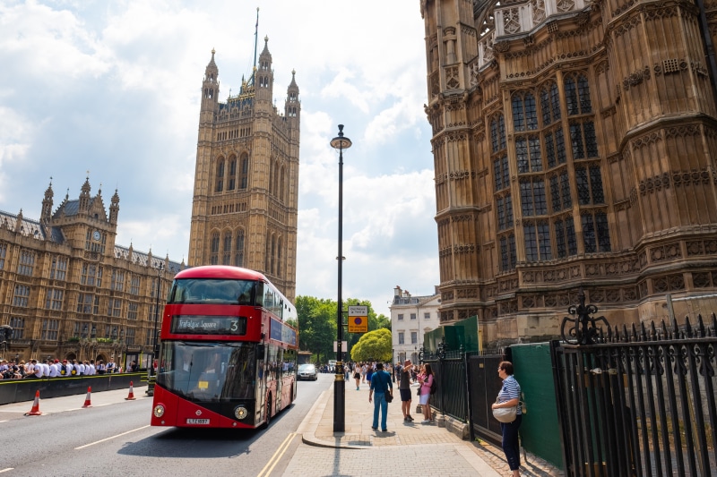 tower, group of people, transportation, abbey, travel, london, government, landmark, outdoors, street, tourism, cloud - sky, double-decker bus, famous